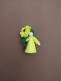 Seasonal doll Calendula with flowers in her hand