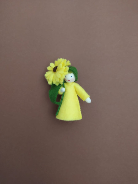 Seasonal doll Calendula with flowers in her hand