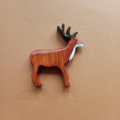 Wooden deer with antler