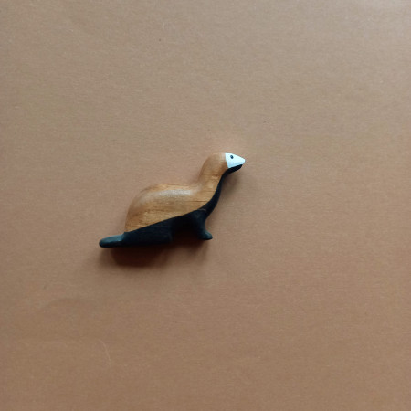 Wooden ferret sitting