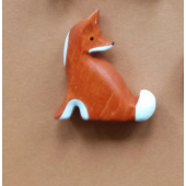 wooden sitting fox looking back