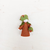 Seasonal doll strawberry with flowers in her hand