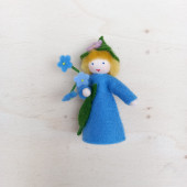Seasonal doll forget Me Not with flowers in her hand