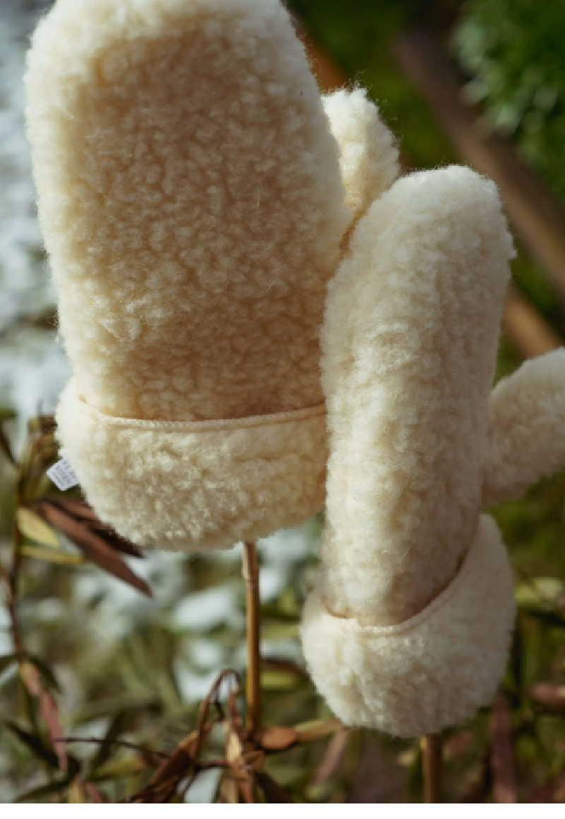 We are woven woolen mittens flat white