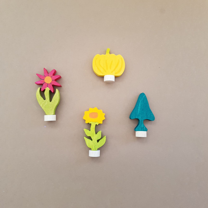 Figurines with plants flowers and trees